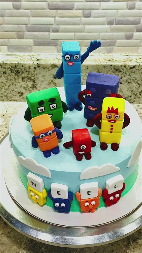Fourteen is made of 10 white blocks and 4 lime green blocks. . Numberblocks cake